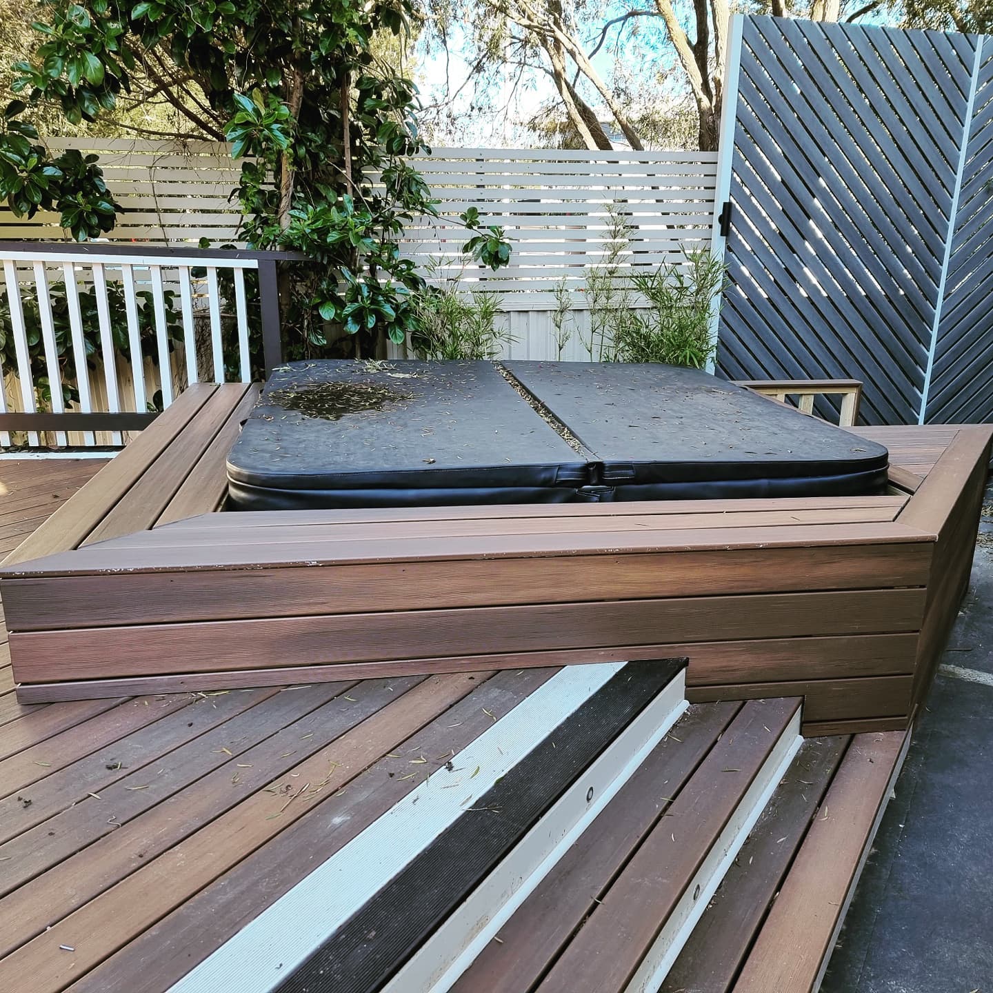 Close-up of spa surround and deck bench