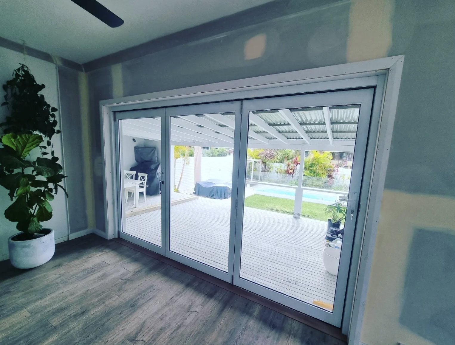 Custom bifold door installation with structural steel beam on the Central Coast NSW