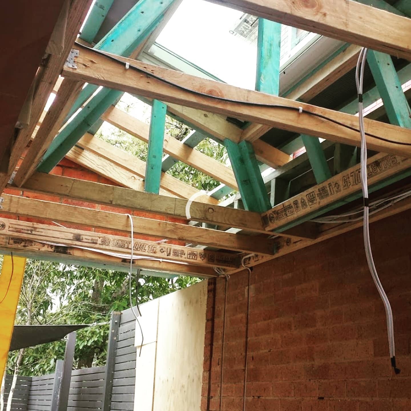 Timber roof framing with skylight opening