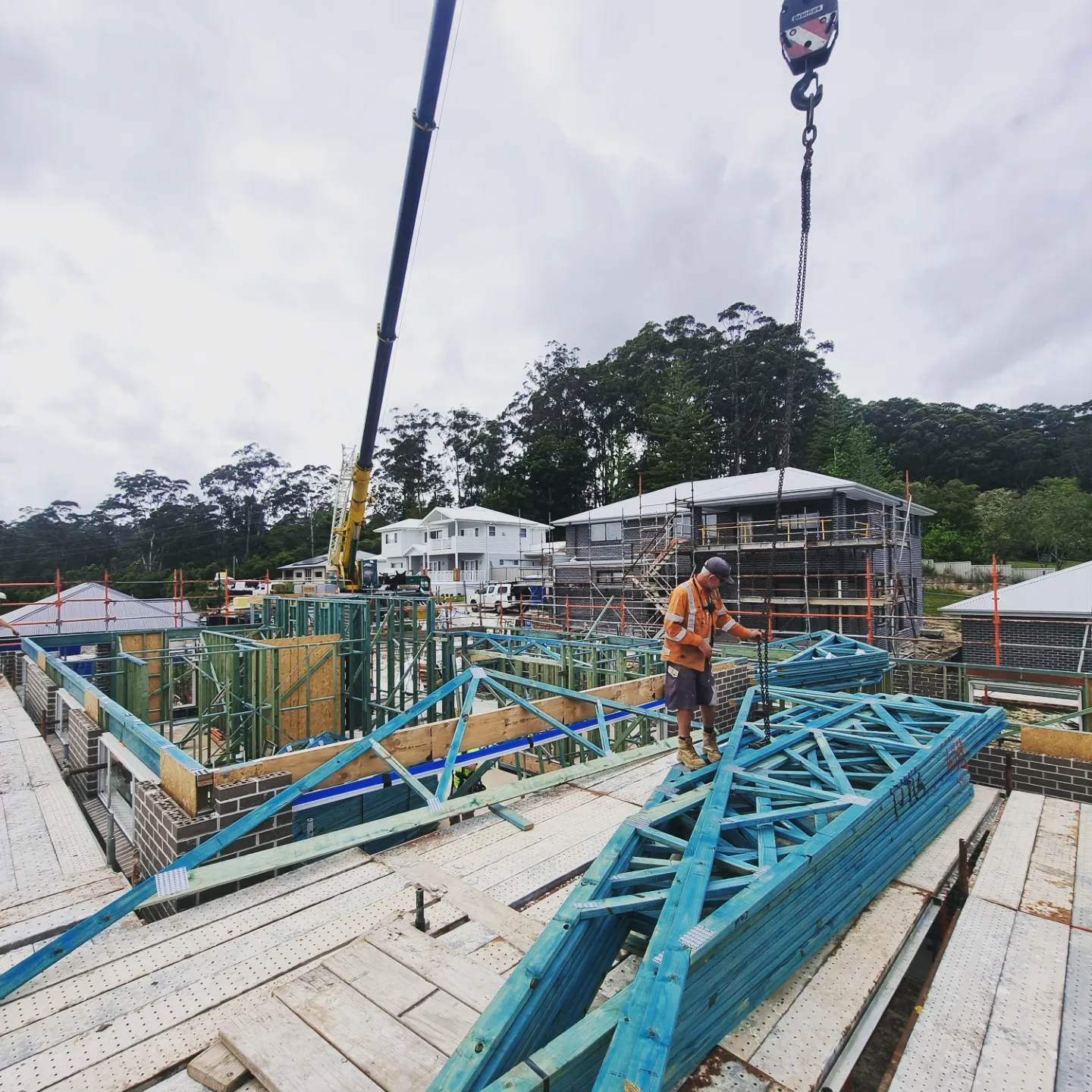 Roof trusses being craned onto a new home build