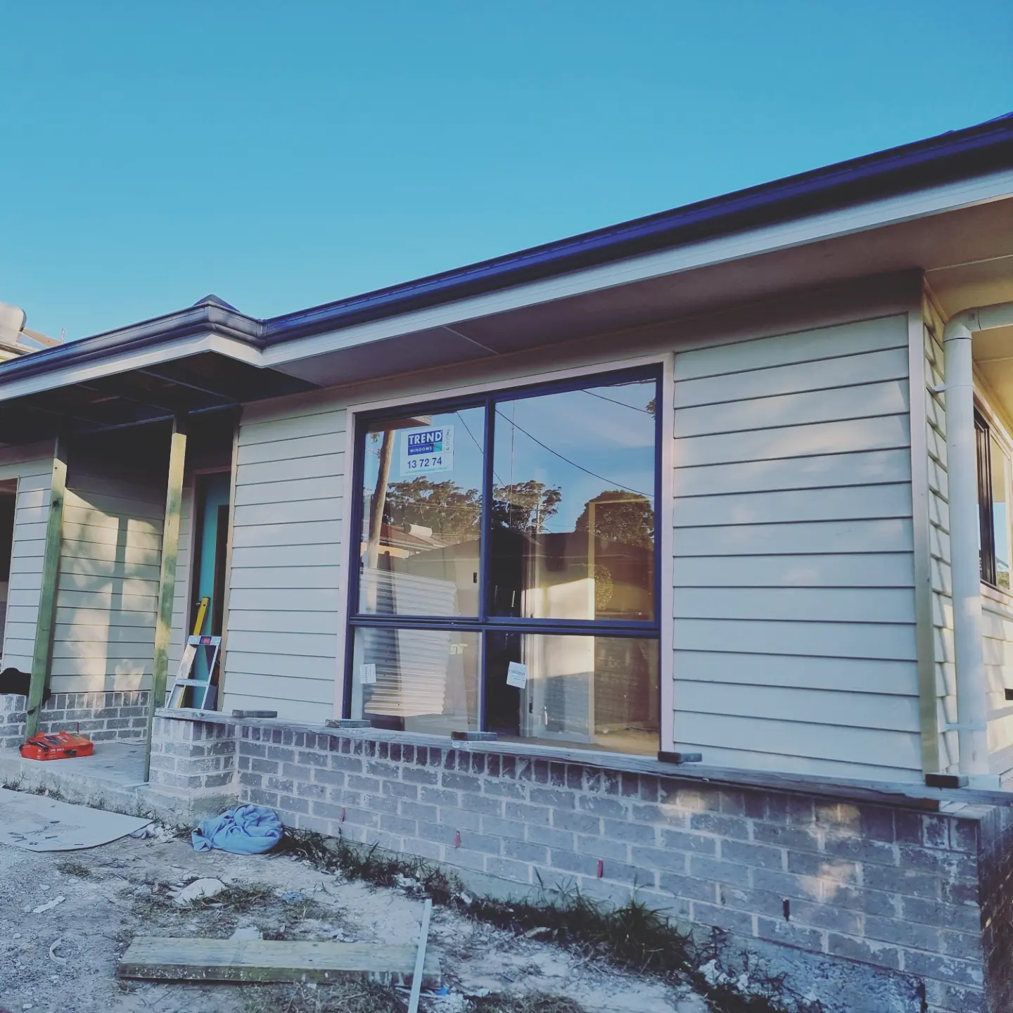 New picture window installed in weatherboard cladding