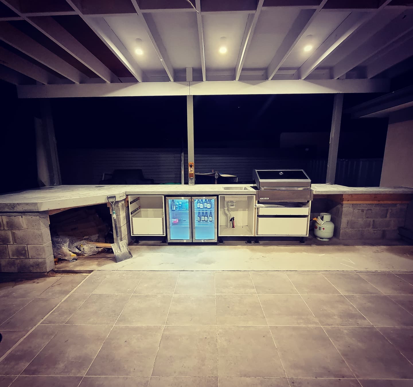Custom outdoor kitchen with concrete benchtop
