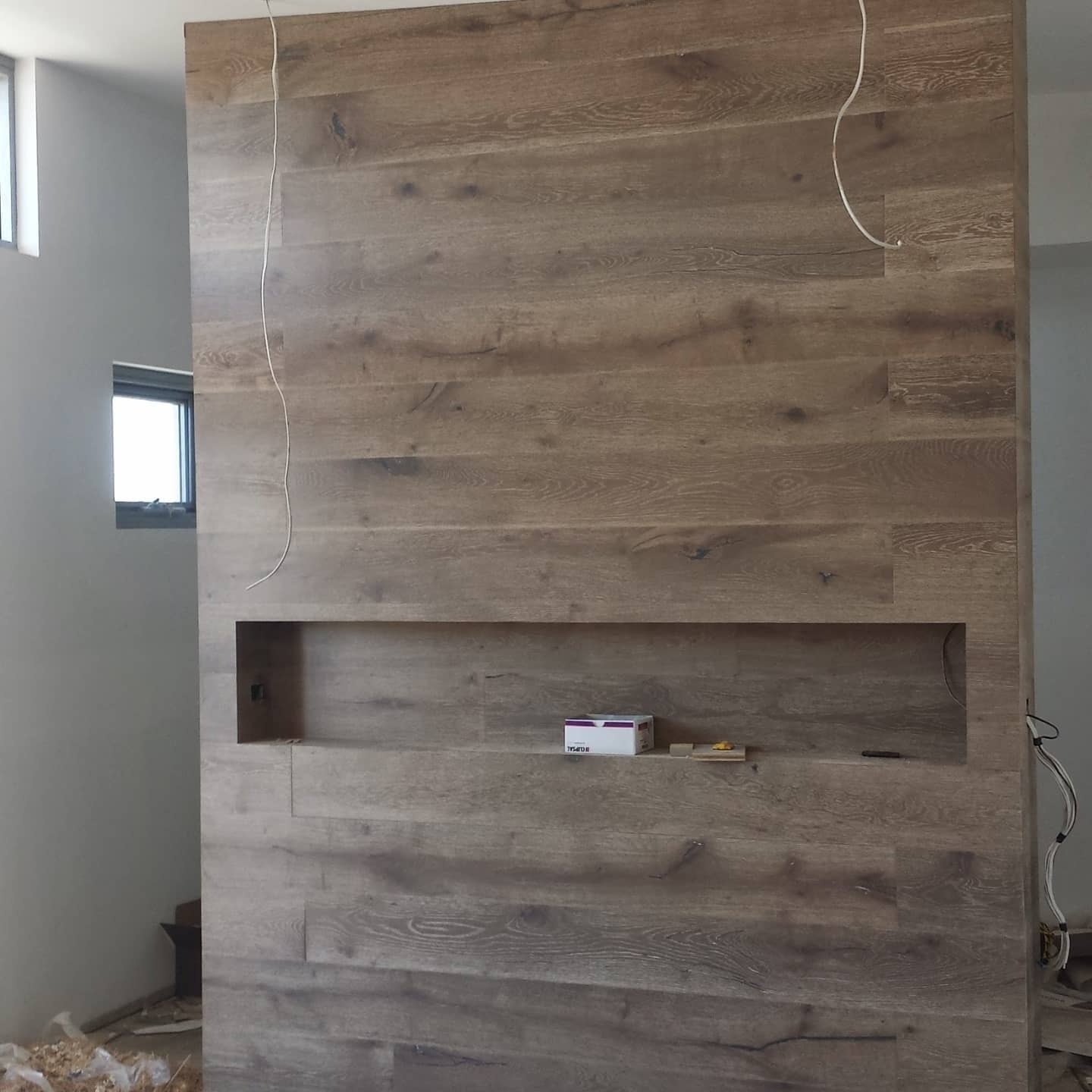 Timber-clad feature wall with recessed TV niche